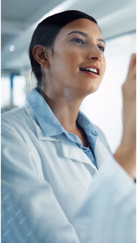 Woman in lab coat.